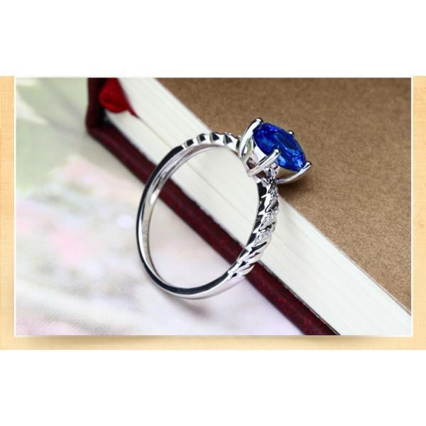 1.25 Carat Oval Cut Sapphire and Diamond Halo Engagement Ring