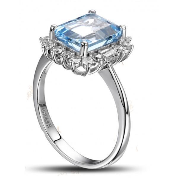 Beautiful 1.50 Carat blue topaz and diamond halo engagement ring