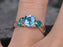 1.25 Carat Round Topaz and Emerald Cut Engagement Ring in White Gold