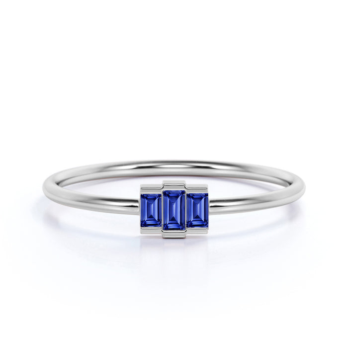 0.56 Carat Dainty Emerald Cut Sapphire Trilogy Ring in White Gold
