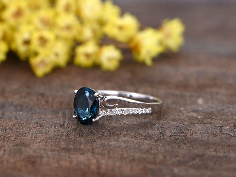 1.25 Carat Oval London Blue Topaz and Diamond Curved Split Shank Engagement Ring in White Gold