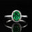 1 Carat oval cut Emerald and Diamond Halo Engagement Ring