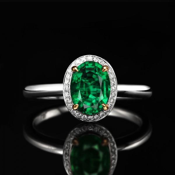 1 Carat oval cut Emerald and Diamond Halo Engagement Ring