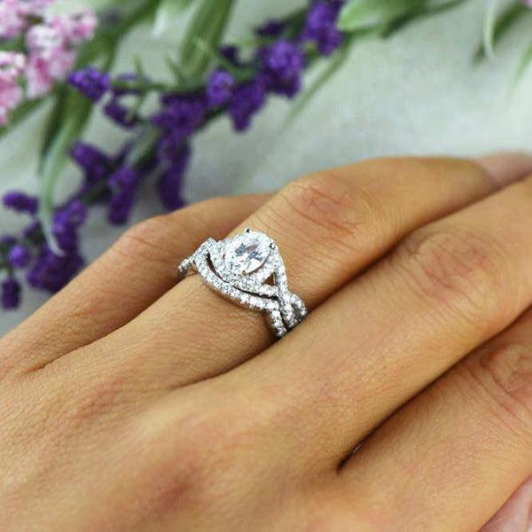 2 Carat Oval Cut Twisted Halo Wedding Ring Set in White Gold over Sterling Silver