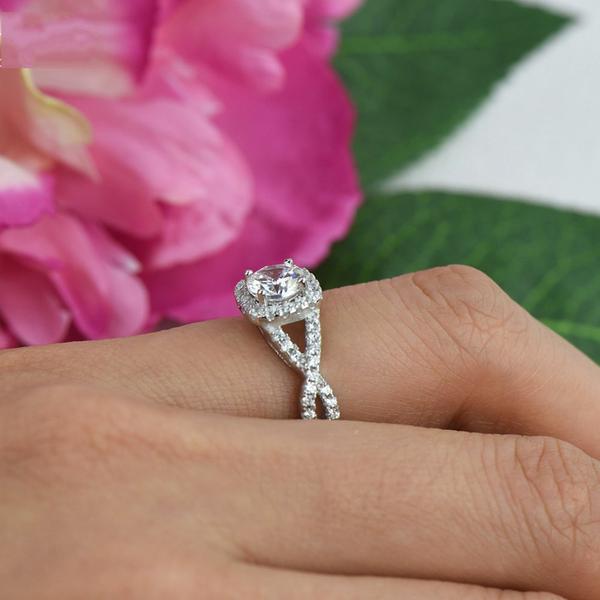 1.5 Carat Round Cut Twisted Halo Engagement Ring in White Gold Over Sterling Silver