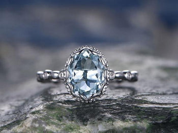 Unique 1.25 Carat Round Cut Aquamarine and Diamond Engagement Ring in White Gold
