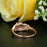 Glamorous 1.25 Carat Round Cut Black Diamond and Diamond Engagement Ring in Rose Gold