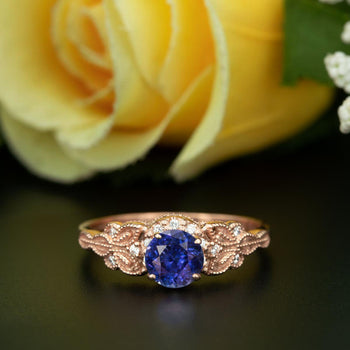Glamorous 1.25 Carat Round Cut Sapphire and Diamond Engagement Ring in Rose Gold