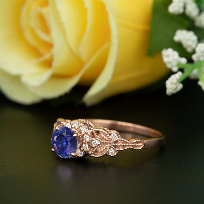 Glamorous 1.25 Carat Round Cut Sapphire and Diamond Engagement Ring in Rose Gold