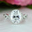 3.5 Carat Oval Cut Twisted Halo Engagement Ring in White Gold over Sterling Silver