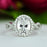 2.5 Carat Oval Twisted Halo Engagement Ring in White Gold over Sterling Silver