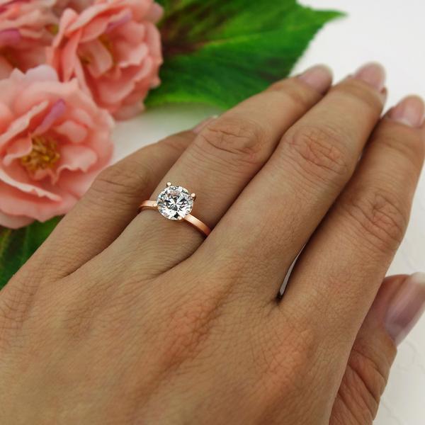 Four Prongs 1.5 Carat Round Cut Solitaire Engagement Ring in Rose Gold Over Sterling Silver