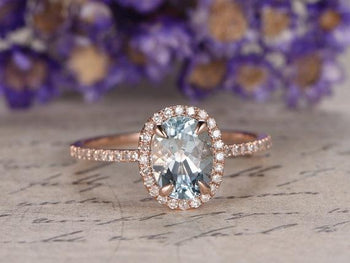 1.50 Carat Oval Cut Aquamarine and Diamond Halo Engagement Ring in Rose Gold