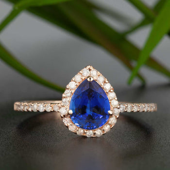 1.25 Carat Pear Cut Sapphire and Diamond Engagement Ring in Rose Gold for Modern Brides