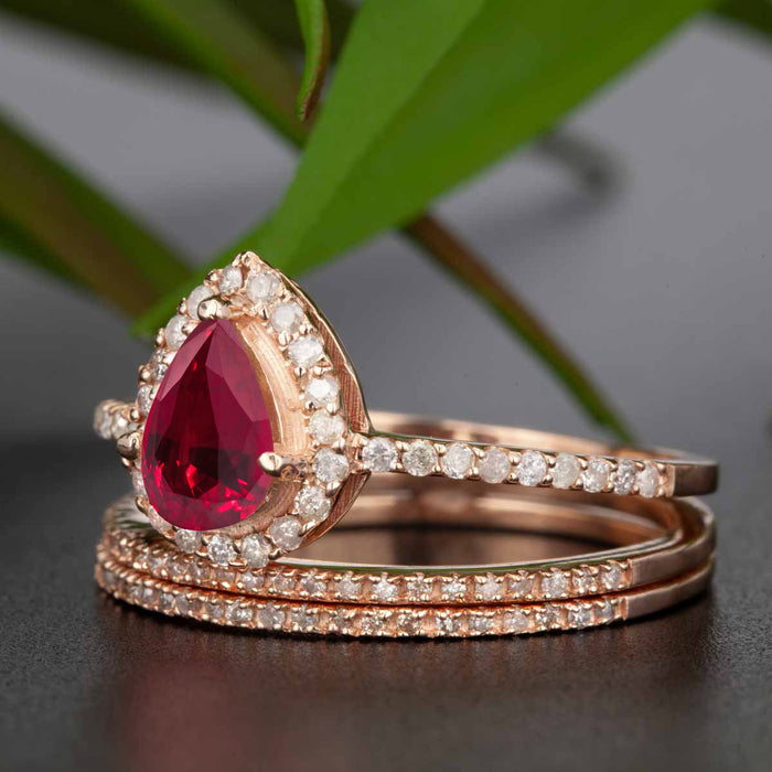 2 Carat Pear Cut Ruby and Diamond Trio Wedding Ring Set in 9k Rose Gold for Modern Brides