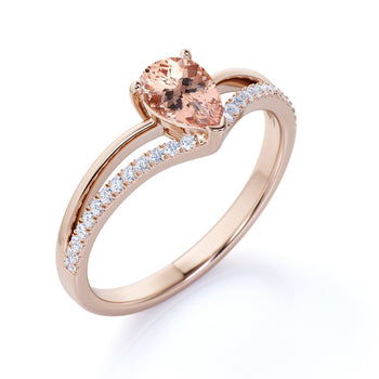 1.5 Carat Pear Shaped Morganite Split-Shank Chevron Engagement Ring with Pave Diamonds in Rose Gold