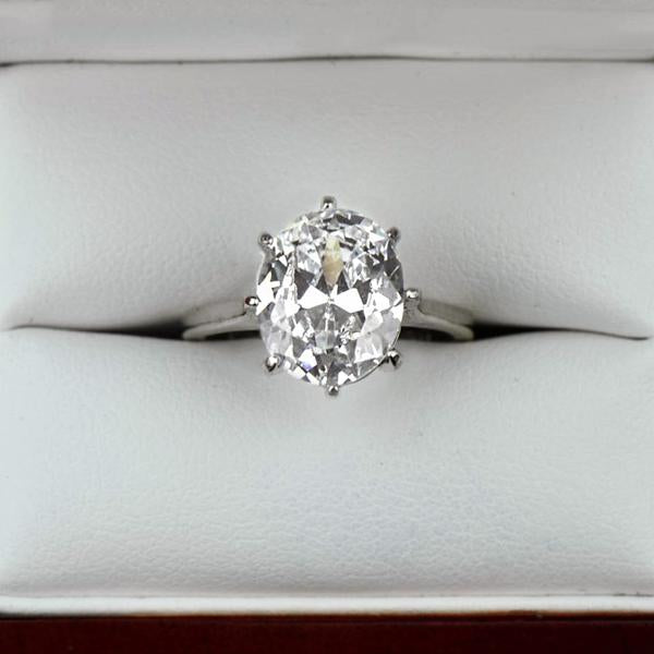 4 Carat Oval Cut Solitaire Engagement Ring in White Gold over Sterling Silver