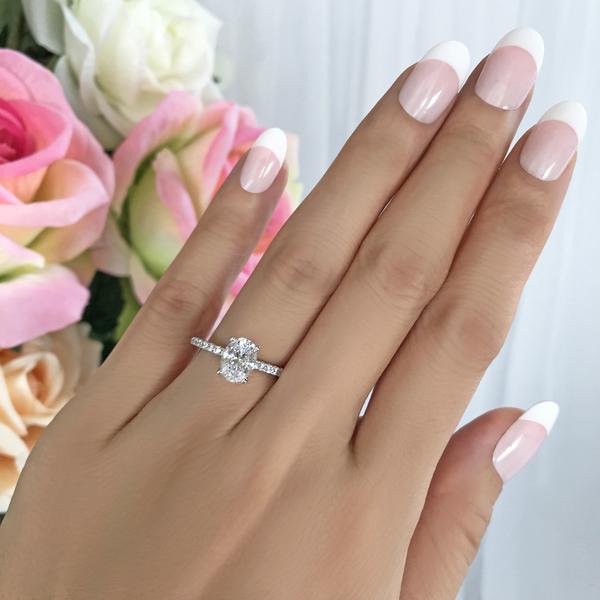 Accented 1.25 Carat Oval Cut Engagement Ring in White Gold over Sterling Silver
