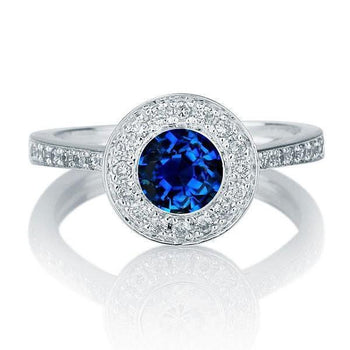1.25 carat Round Cut Sapphire and Diamond Halo Engagement Ring