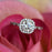 Art Deco 1.5 Carat Round Cut Halo Engagement Ring in White Gold over Sterling Silver