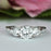 Three Stones 2 Carat Round Cut Filigree Engagement Ring in White Gold over Sterling Silver
