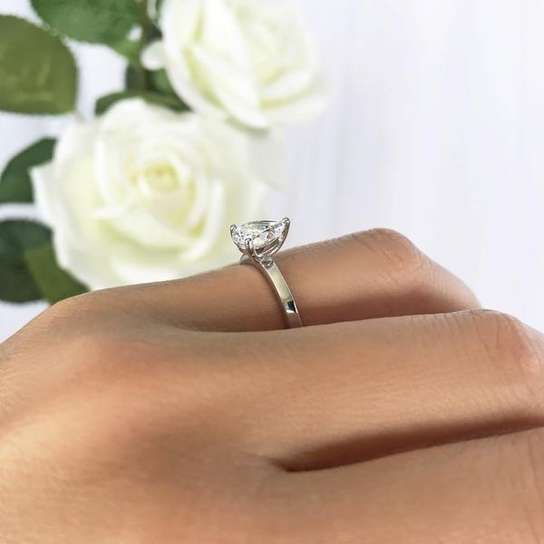 1.25 Carat Pear Cut Solitaire Engagement Ring in White Gold over Sterling Silver