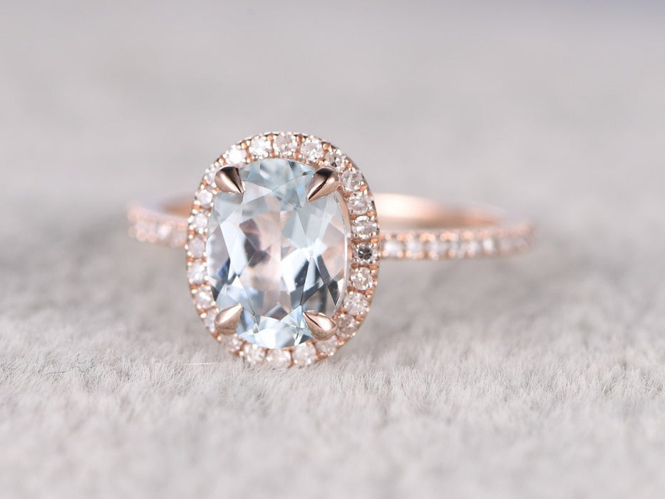 1.50 Carat oval cut Aquamarine and Diamond Engagement Ring in Rose Gold