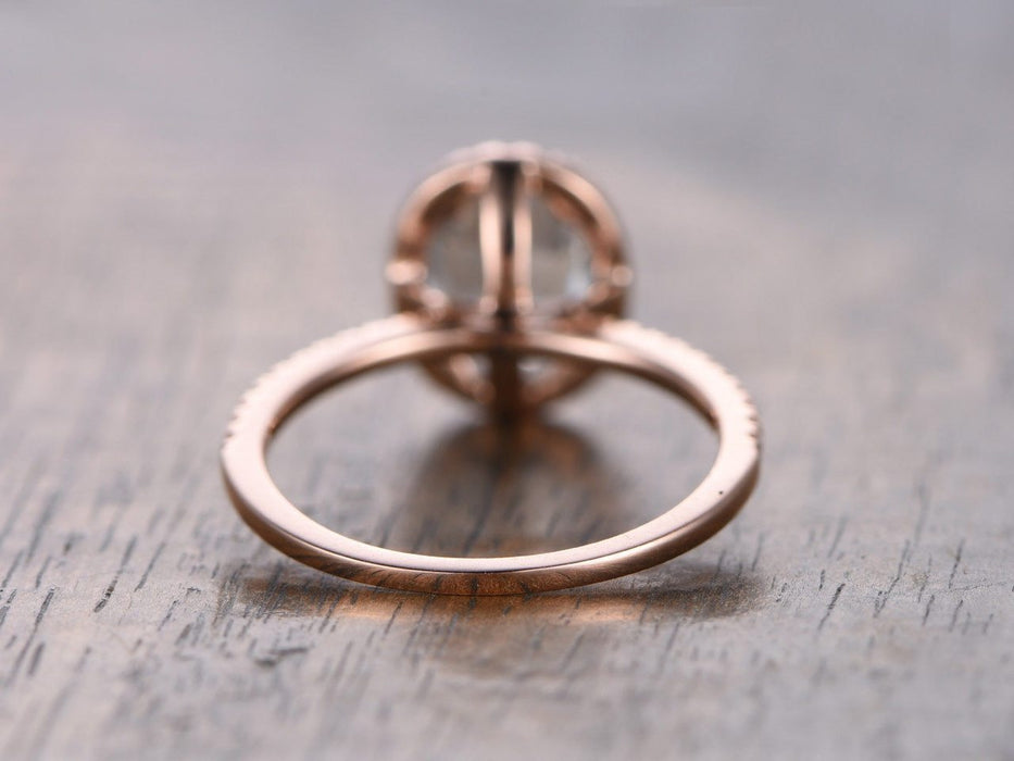 1.25 Carat oval cut Aquamarine and Diamond Halo Wedding Ring in Rose Gold