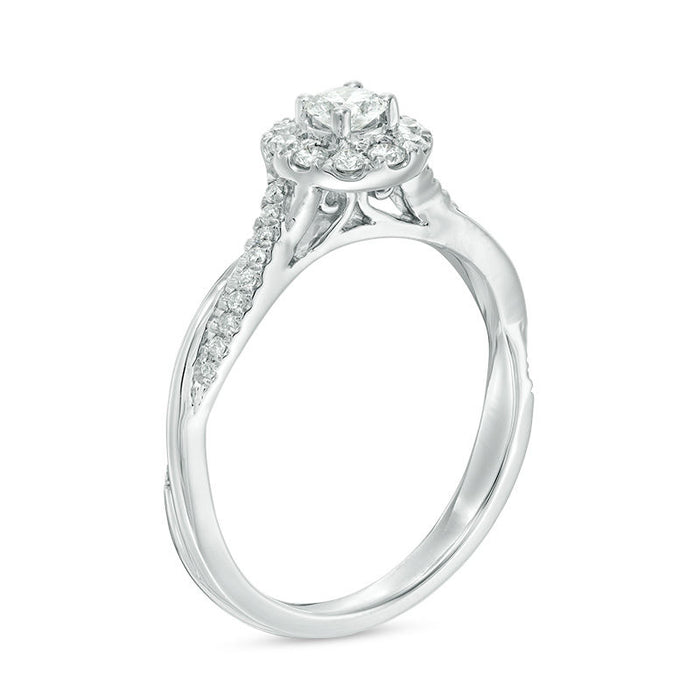 1/2 CT.T.W. Round Cut Diamond Halo Twist Engagement Ring in White Gold