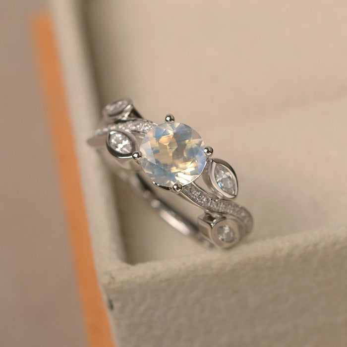 Leaf Design 1.50 Carat Round Cut Blue Moonstone and Diamond Channel Engagement Ring in White Gold