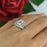 2.5 Carat Oval Cut Twisted Halo Three Band Ring Set in White Gold over Sterling Silver