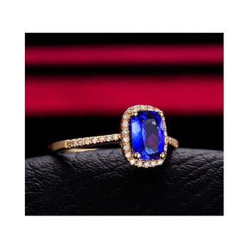 1.50 Carat Oval Cut Blue Sapphire and Diamond Halo Engagement Ring