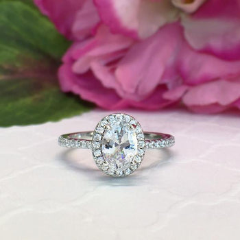 Beautiful 1.5 Carat Oval Cut Halo Engagement Ring in white Gold over Sterling Silver