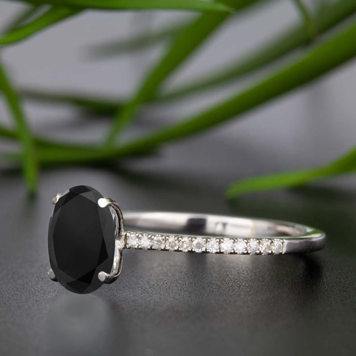 Flawless 1.25 Carat Oval Cut Black Diamond and Diamond Engagement Ring in White Gold