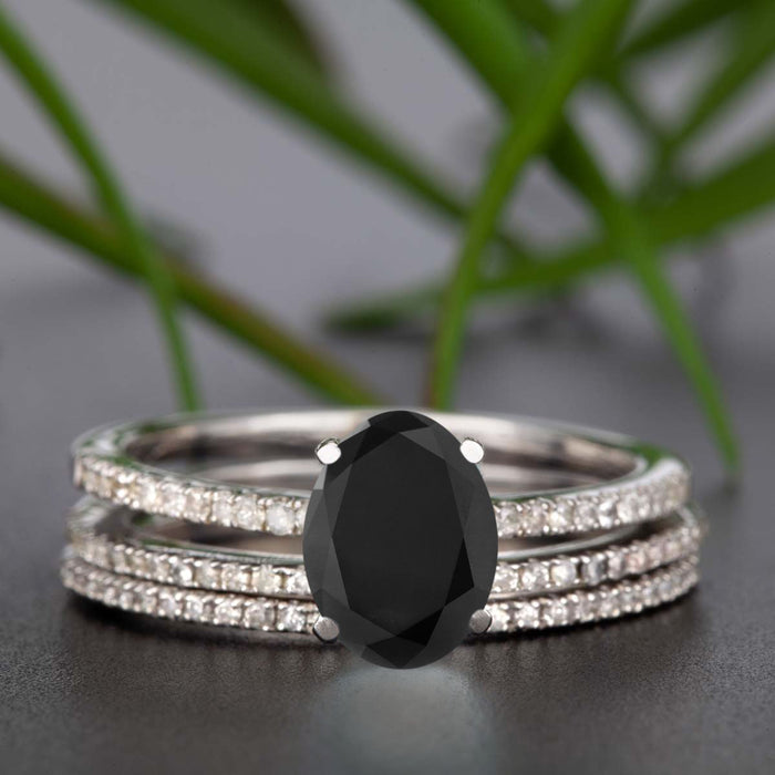 Flawless 1.50 Carat Oval Cut Black Diamond and Diamond Trio Wedding Ring Set in White Gold