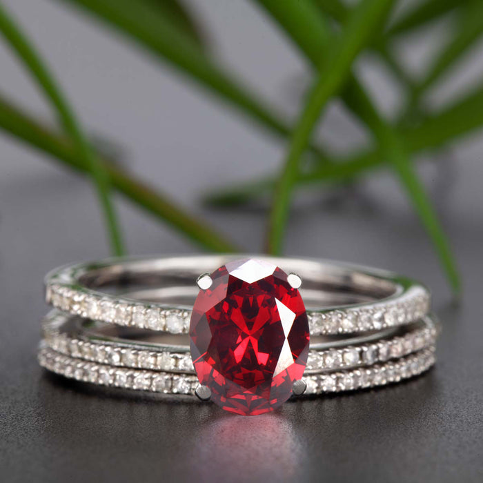 Flawless 2 Carat Oval Cut Ruby and Diamond Engagement Ring with 2 Matching Wedding Bands in 9k White Gold