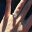 1.5 Carat Pear Cut Halo Engagement Ring in White Gold over Sterling Silver