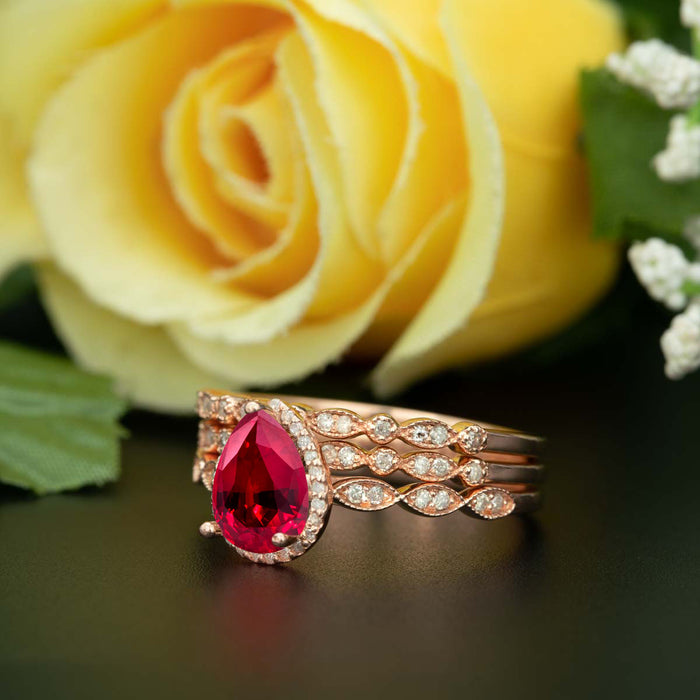 2 Carat Pear Cut Halo Ruby and Diamond Trio Wedding Ring Set in 9k Rose Gold Vintage Ring