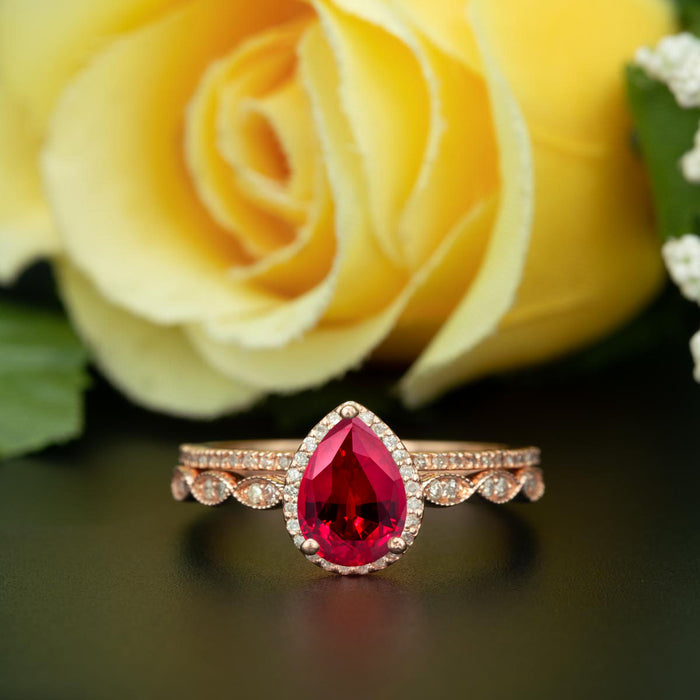 1.5 Carat Pear Cut Halo Ruby and Diamond Ring with Classic Wedding Band in 9k Rose Gold