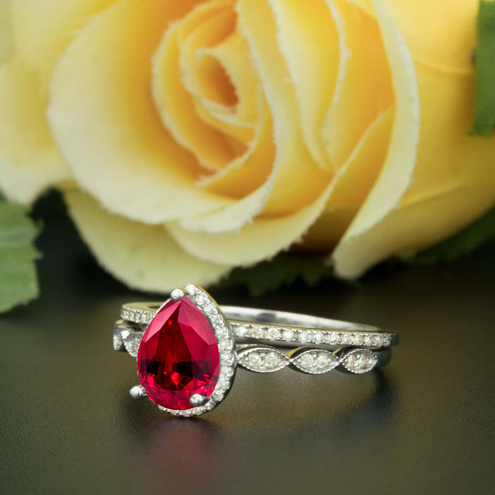1.5 Carat Pear Cut Halo Ruby and Diamond Ring with Classic Wedding Band in 9k White Gold