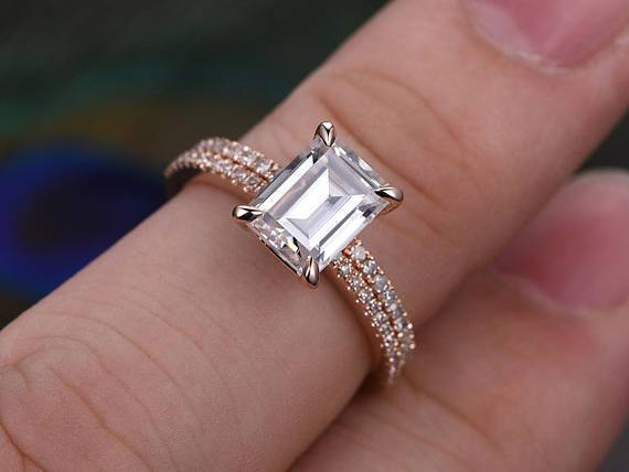 2 Carat Emerald Cut Moissanite and Diamond Halo Bridal Set in Rose Gold
