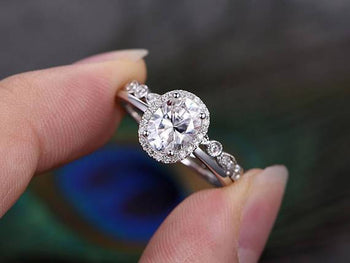1.50 Carat Oval Cut Moissanite and Diamond Halo Wedding Set in White Gold