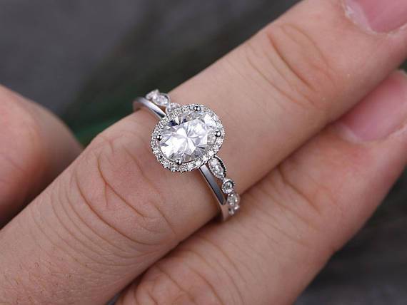 1.50 Carat Oval Cut Moissanite and Diamond Halo Wedding Set in White Gold