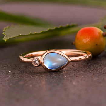 Two Stone 1.05 Carat Pear Shape Blue Moonstone and Diamond Bezel Engagement Ring in Rose Gold