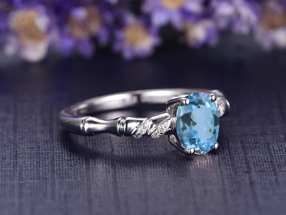 Beautiful 1.25 Carat Oval Cut Aquamarine and Diamond Engagement Ring in White Gold