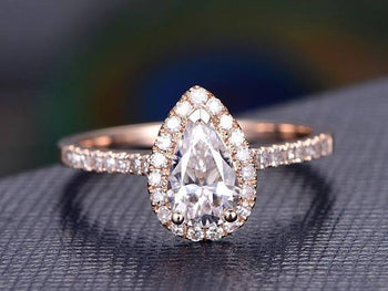 1.50 Carat Pear Cut Moissanite and Diamond Halo Engagement Ring in Rose Gold