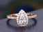 1.50 Carat Pear Cut Moissanite and Diamond Halo Engagement Ring in Rose Gold