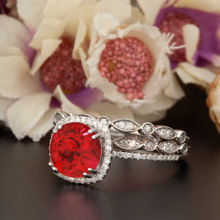 2 Carat Cushion Cut Halo Ruby and Diamond Ring with 2 Classic Wedding Bands in 9k White Gold