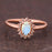 Antique 1.50 Carat Oval Cabochon Cut Blue Moonstone and Diamond Floral Engagement Ring in Rose Gold