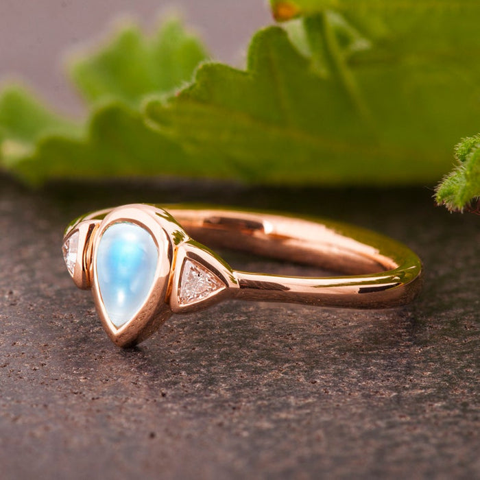 Bezel Setting 1.10 Carat Pear Shape Blue Moonstone and Diamond Three Stone Engagement Ring in Rose Gold